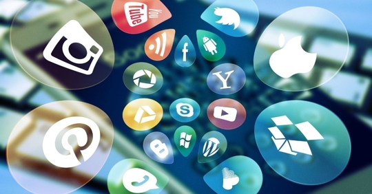 bubbles with icons of social media platforms flying away from an iPhone