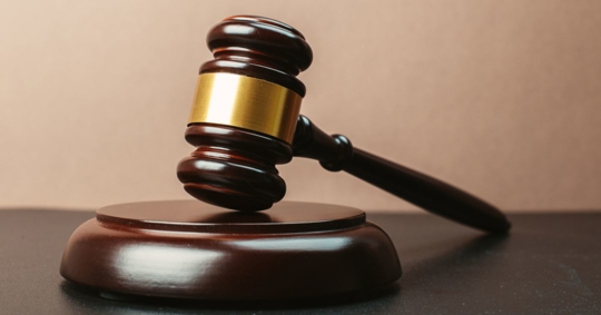 Judge's gavel on block after a decision in a workers' compensation case filed by the Law Offices of Larry S. Buckley.