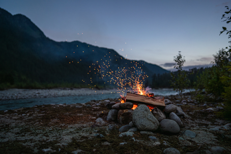 fire burning by lake