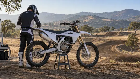 Guy standing by Dirt Bike