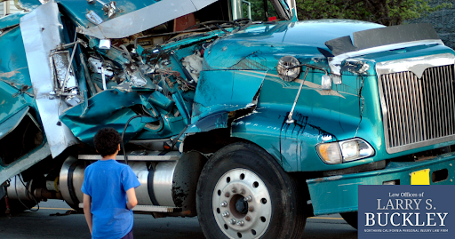 Semi's front right side smashed from a car accident